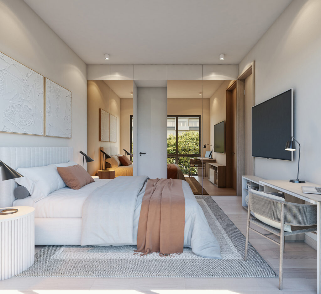 Luxurious bedroom in a Punta Cana condo featuring a modern design with natural light, a comfortable bed, and a dedicated workspace. Ideal for relaxation and productivity.